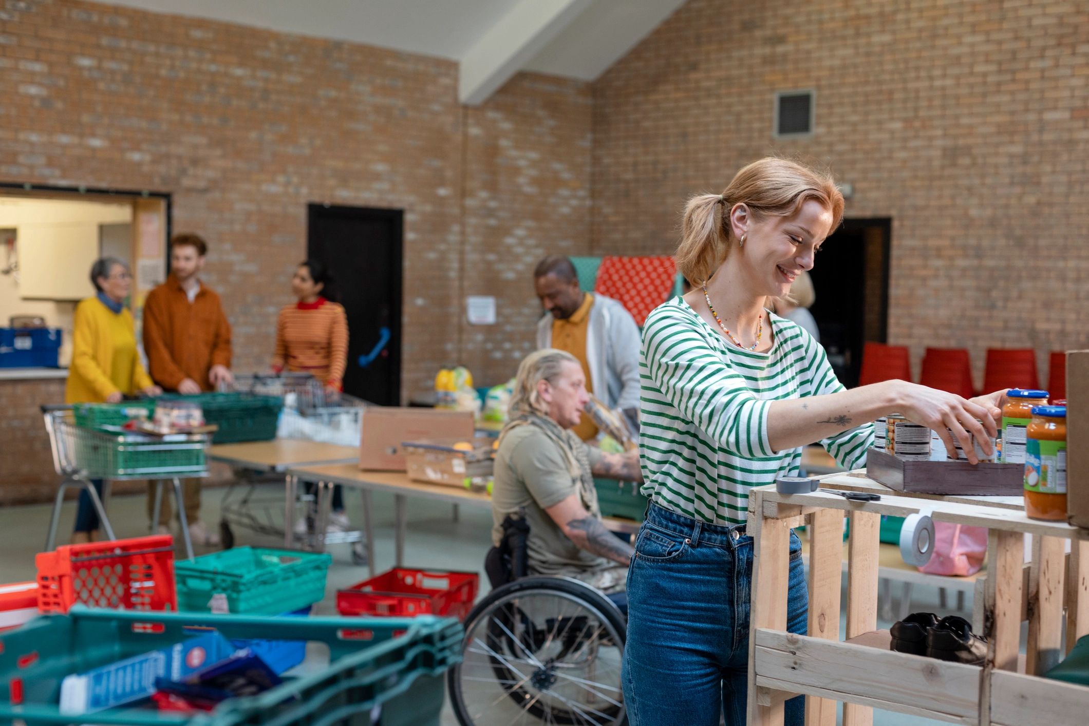 Volunteers organizing food donations at a community support center