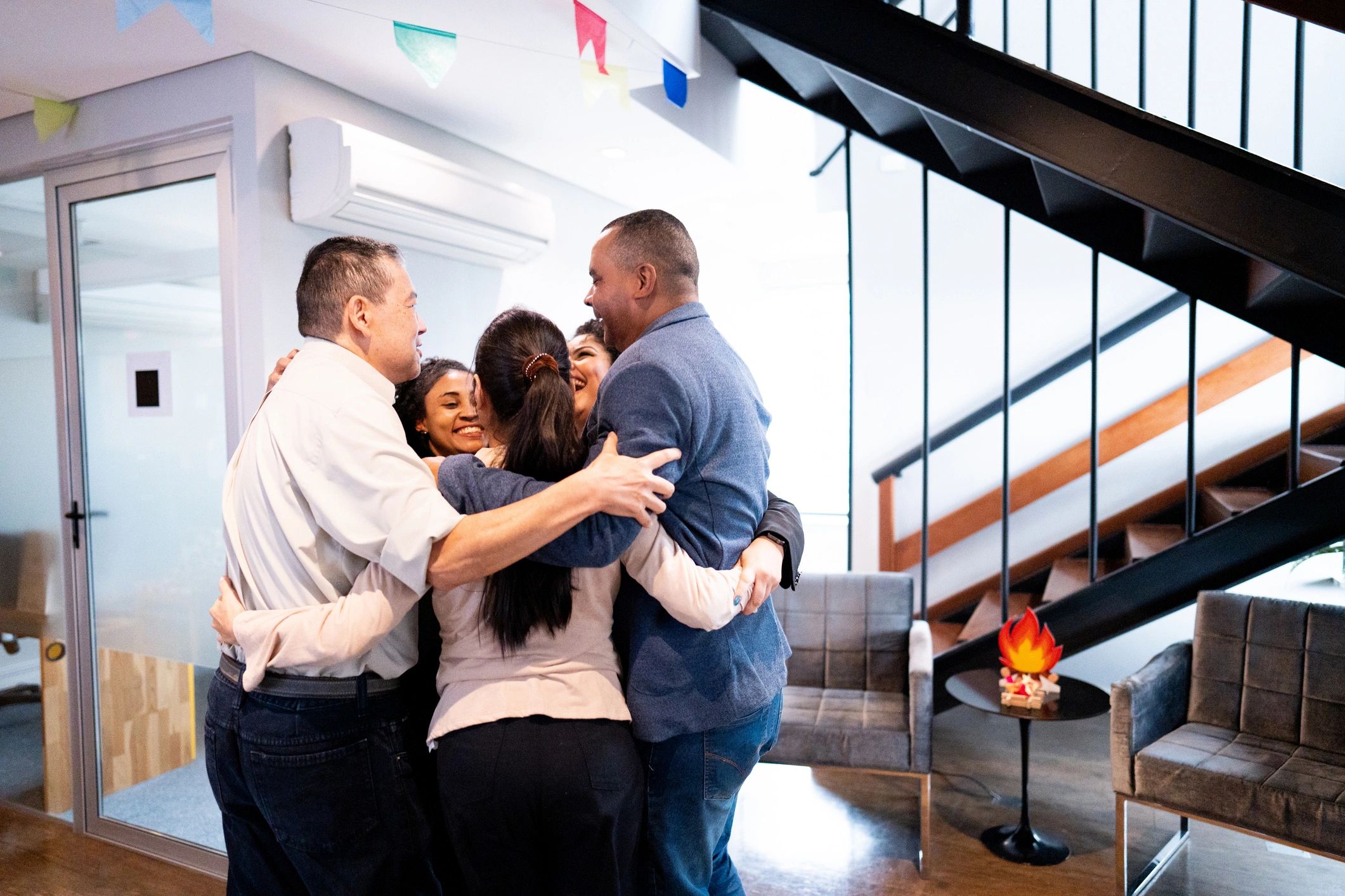 People embracing and celebrating in a supportive community setting